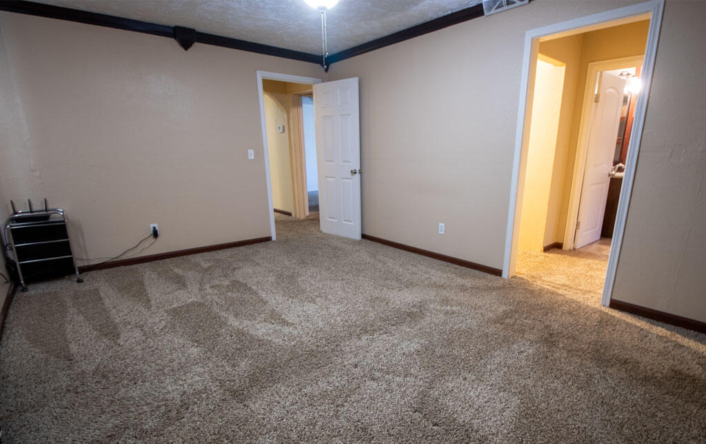 2609 County Road 7110 Lubbock, TX 79404 - Photo 6 of 29 a view of an empty room with a closet