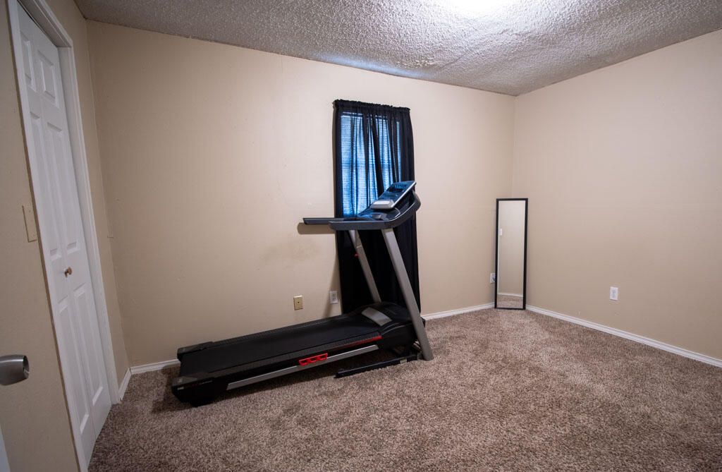2609 County Road 7110 Lubbock, TX 79404 - Photo 10 of 29 a room with gym equipment