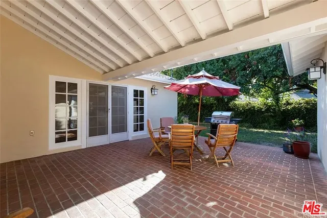 a wooden bench sitting in front of a building