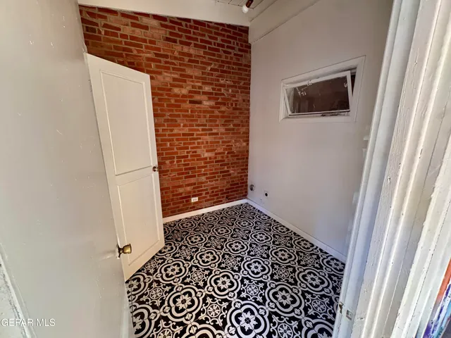 a bathroom with a toilet a sink a mirror and a shower