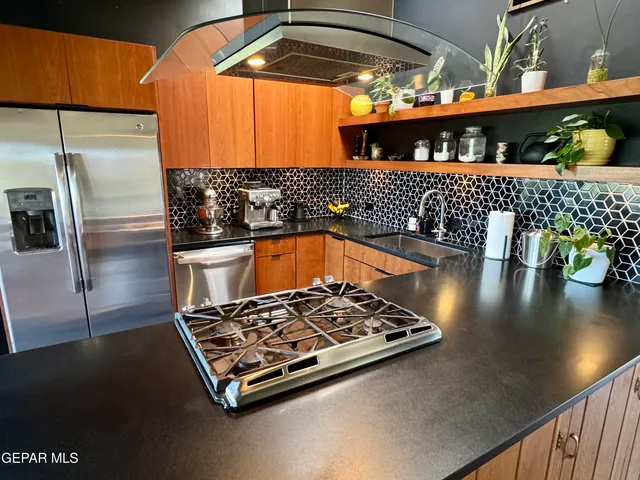 a kitchen with table and chairs
