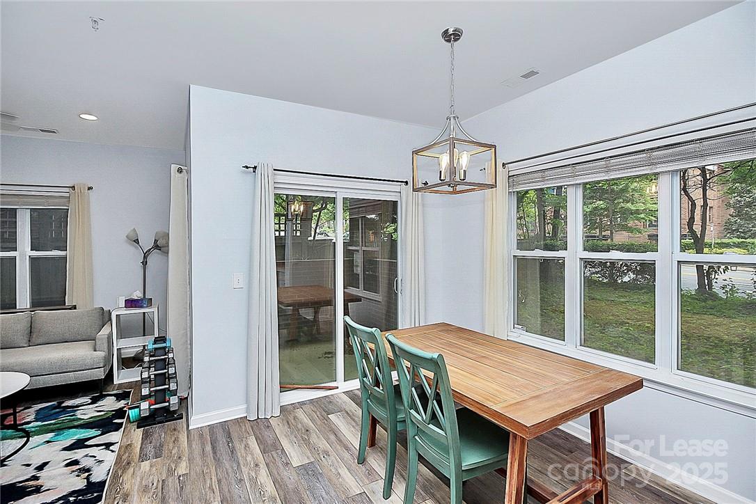 2625 East 5th Street, Unit A Charlotte, NC 28204 - Photo 13 of 24 a view of a livingroom with furniture window and wooden floor