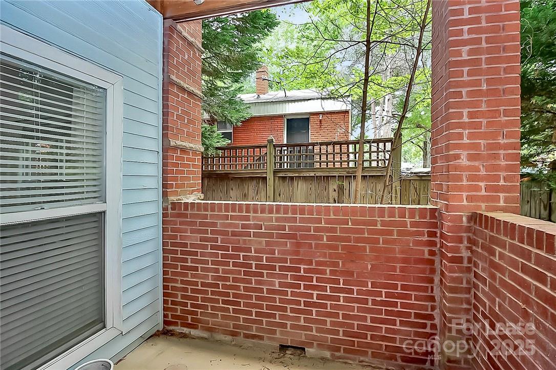 2625 East 5th Street, Unit A Charlotte, NC 28204 - Photo 5 of 24 a view of a brick house with a large window