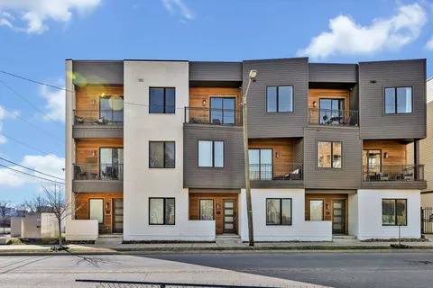 a front view of a multi story residential apartment building