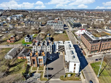 an aerial view of a building with parking