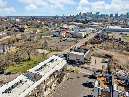 an aerial view of residential building and lake