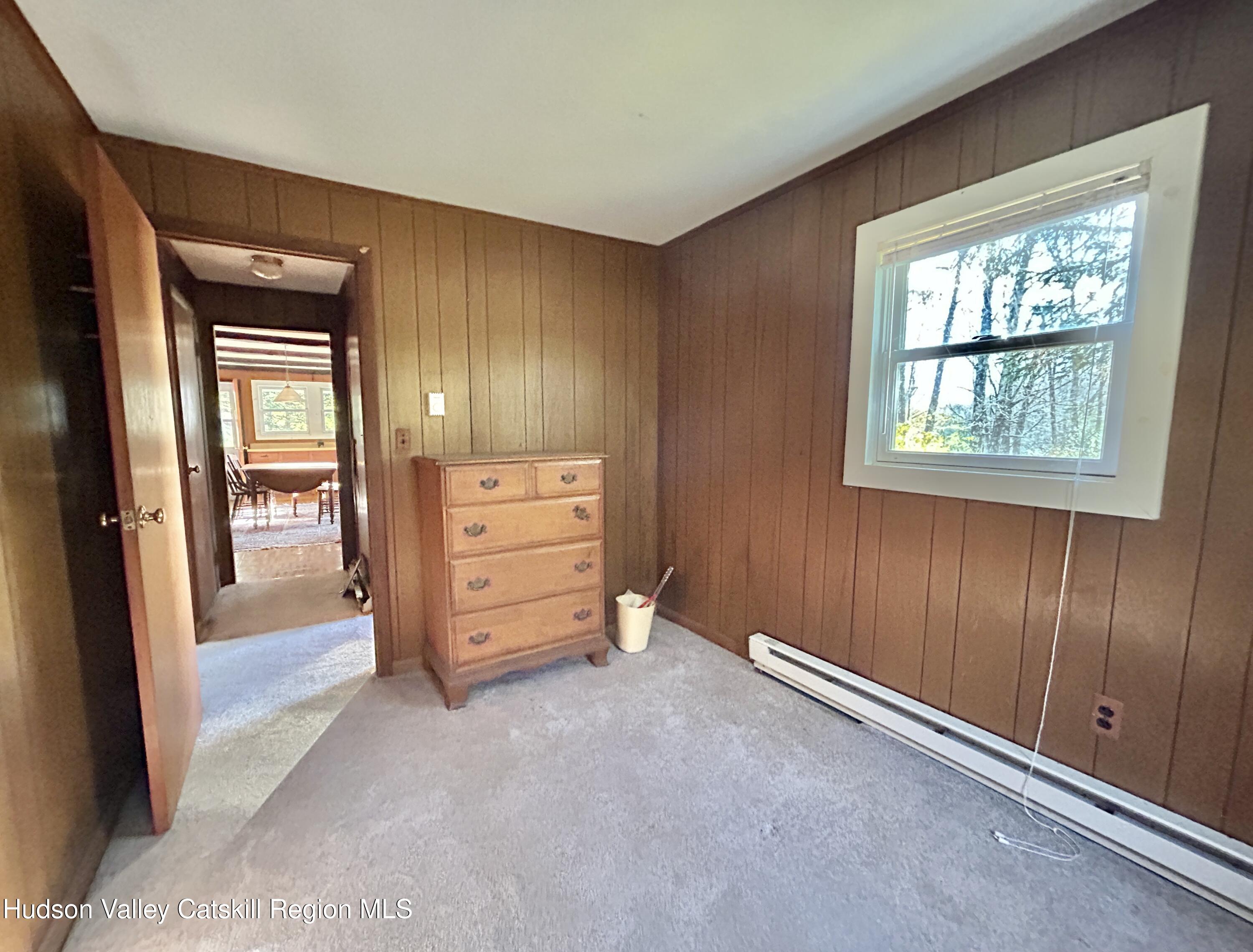 335 Tempaloni Road Ellenville, NY 12428 - Photo 13 of 26 an empty room with windows and closet