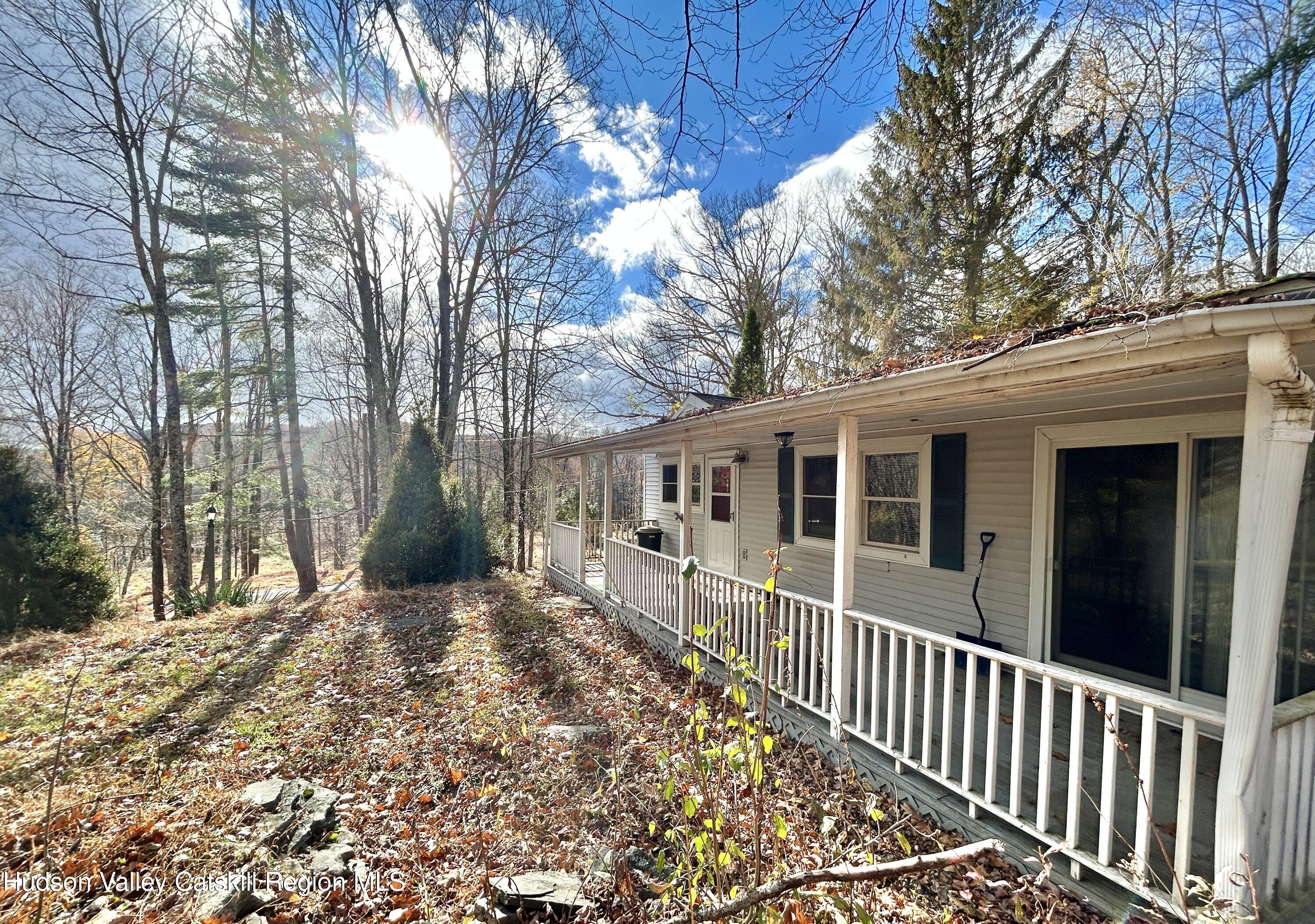 335 Tempaloni Road Ellenville, NY 12428 - Photo 16 of 26 a front view of a house with a yard