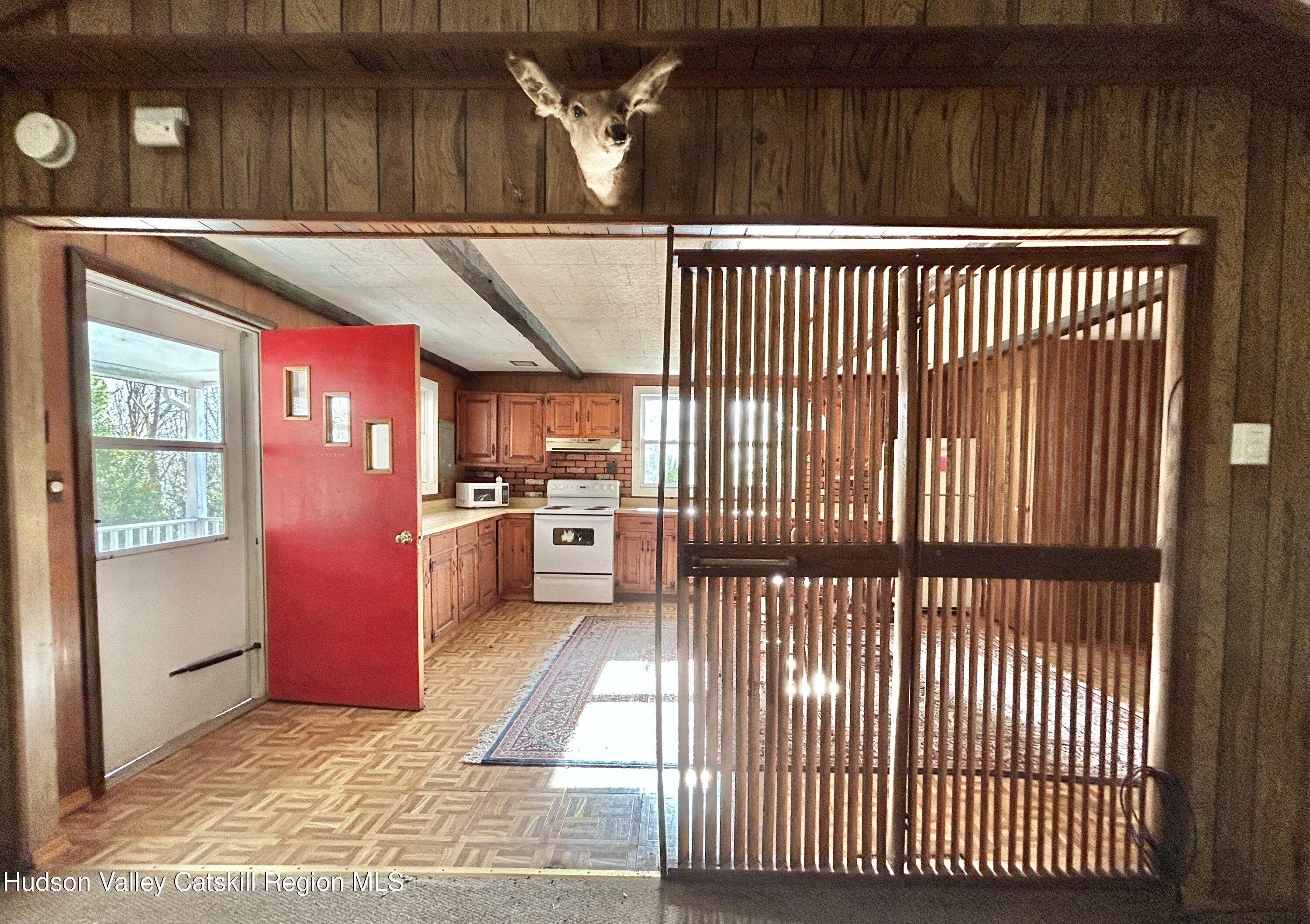 335 Tempaloni Road Ellenville, NY 12428 - Photo 6 of 26 a view of a kitchen with a sink and wooden floor