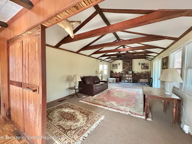 a view of a livingroom with furniture and a garage