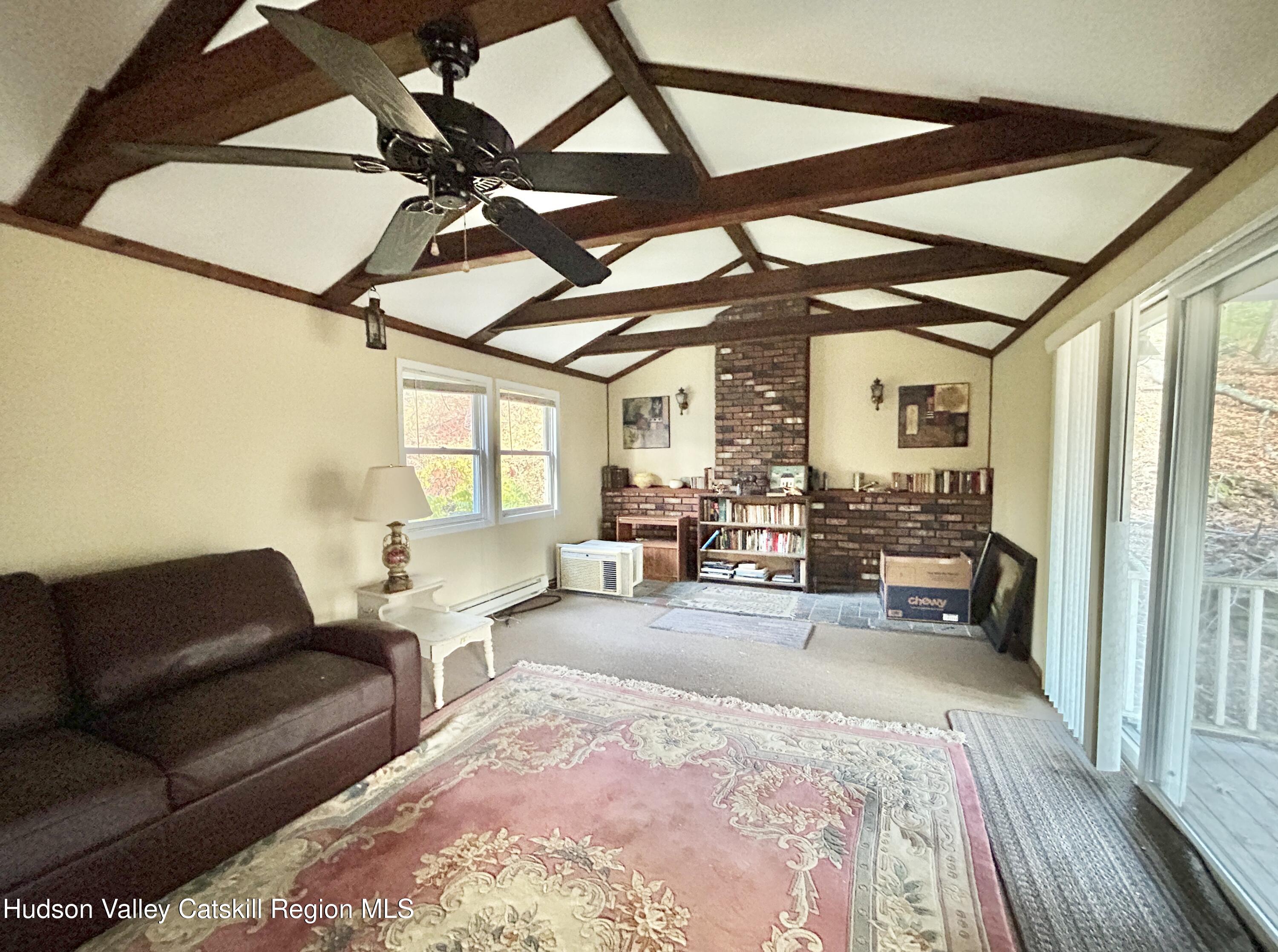 335 Tempaloni Road Ellenville, NY 12428 - Photo 10 of 26 a living room with furniture and a large window