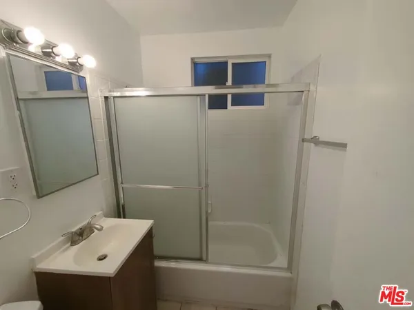 a bathroom with a sink and mirror