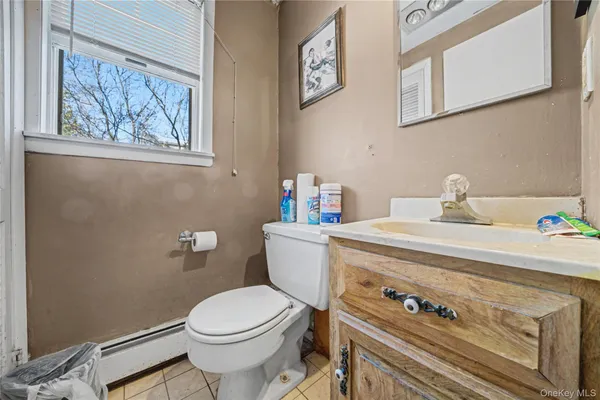 a bathroom with a toilet and a sink