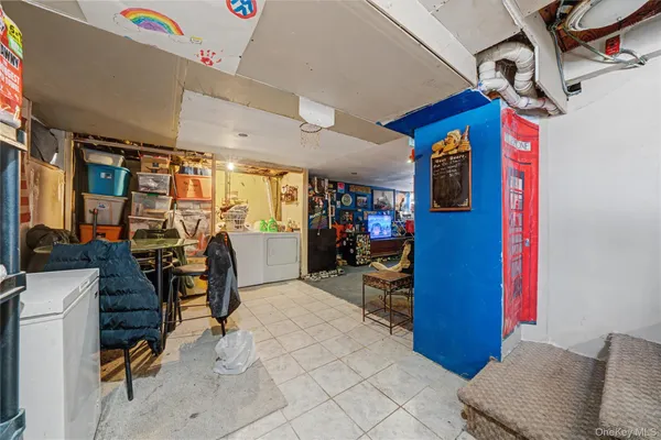 a view of a livingroom with workspace and a couch