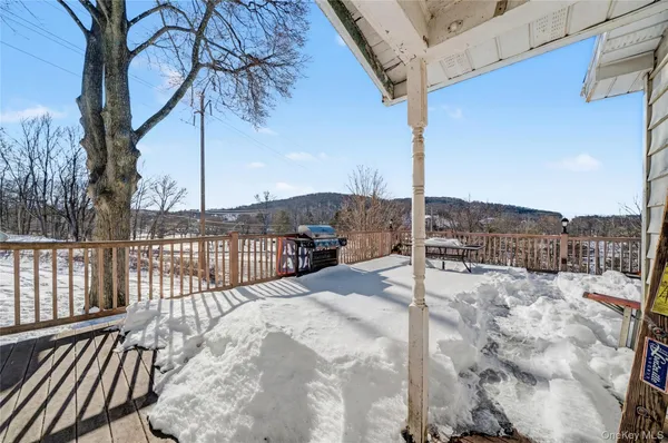 a view of a terrace with a snow on the road