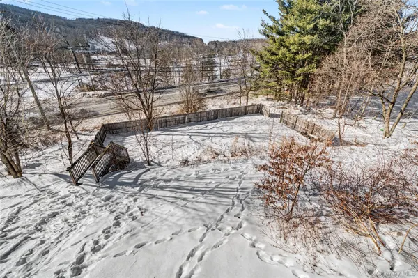 a view of a backyard of the house