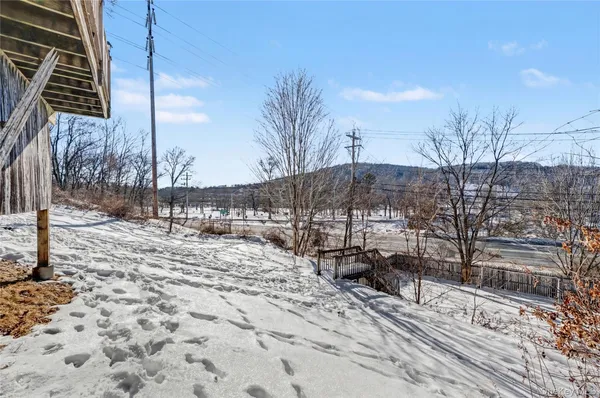 a view of a covered with snow on the road