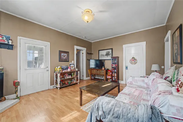 a bedroom with bed and a view of bedroom