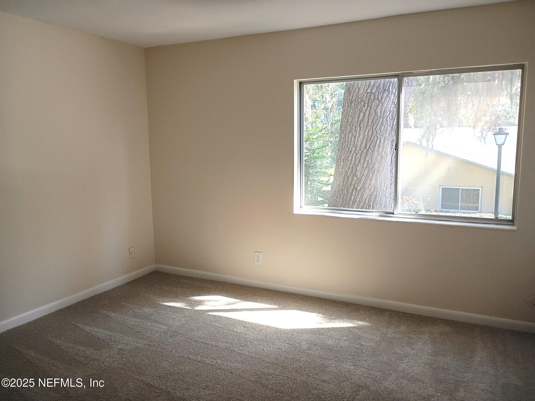 1265 The Grove Road Orange Park, FL 32073 - Photo 12 of 13 an empty room with a window