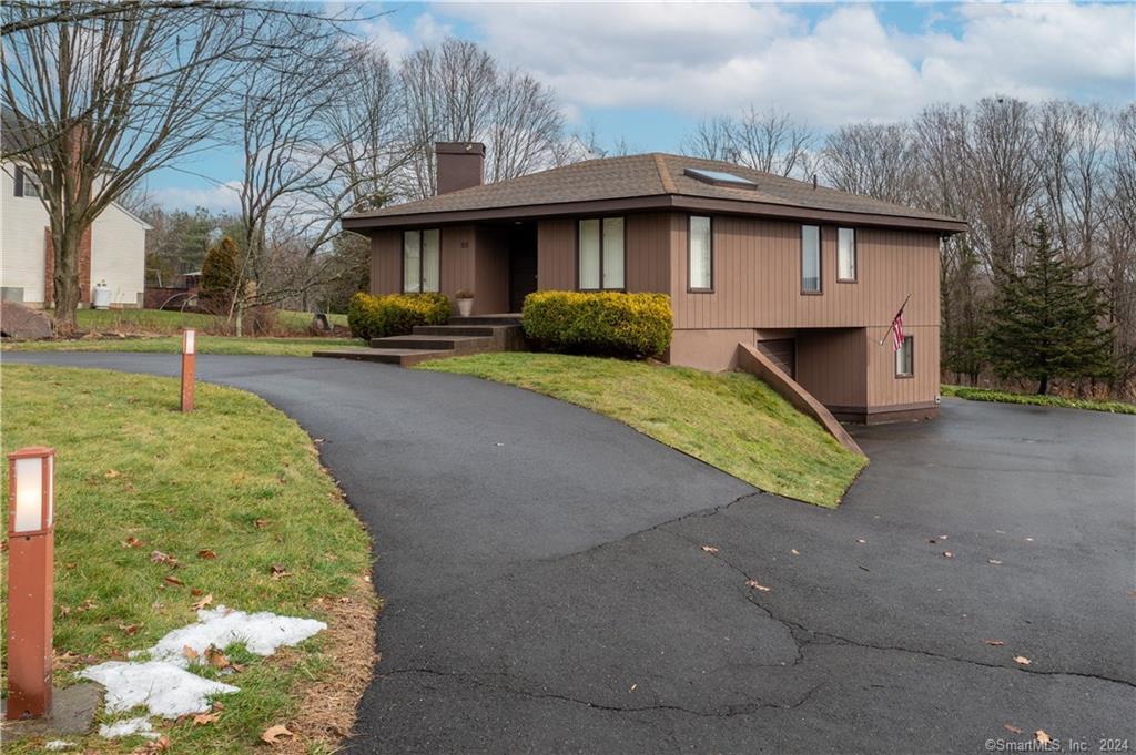 59 Woods Hill Road North Branford, CT 06472 - Photo 1 of 1 a front view of a house with garden
