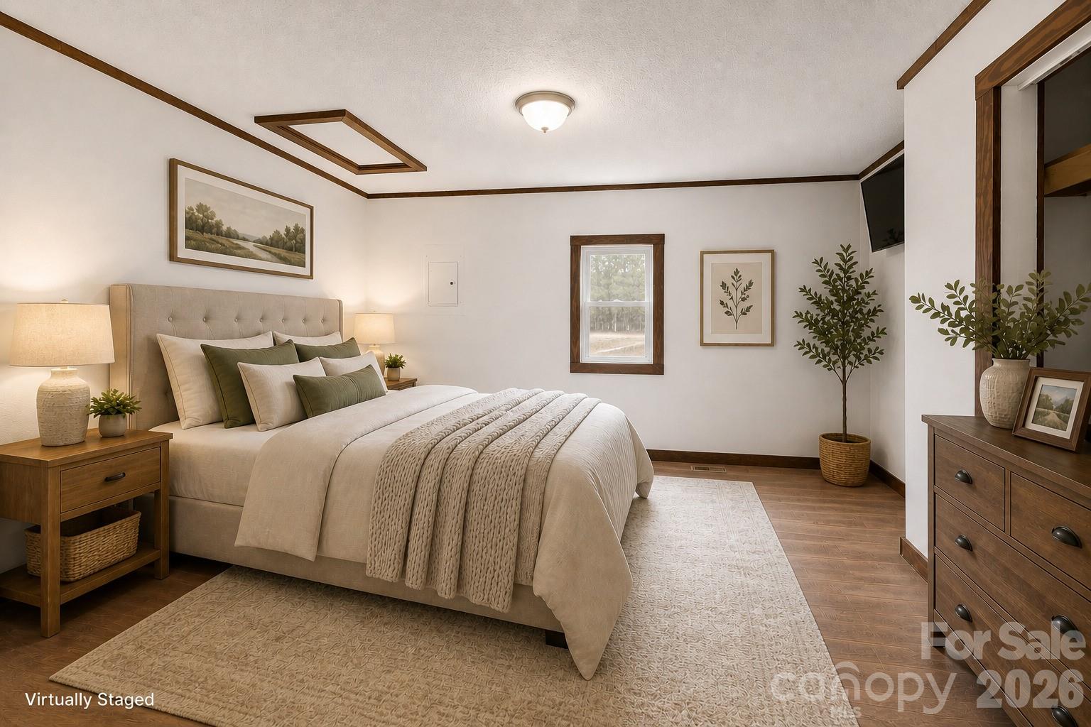 7400 Corn Hill Road Connelly Springs, NC 28612 - Photo 19 of 41 a spacious bedroom with a bed and a potted plant