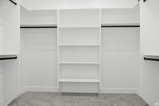 164 North 400 East Preston, ID 83263 - Photo 11 of 21 Built-in white shelving system featuring multiple storage compartments and matte black hanging rods