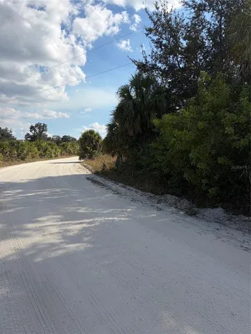 a view of a pathway with a lake view