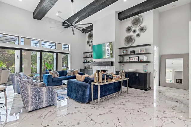 a living room with furniture windows and a fireplace