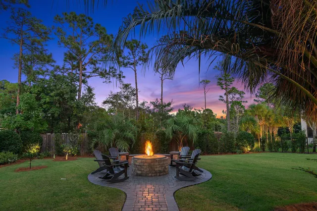 a view of a backyard with sitting area