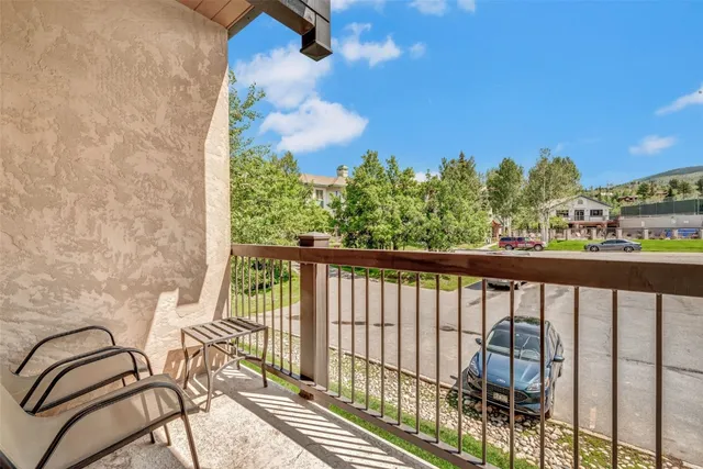 a view of a balcony with furniture