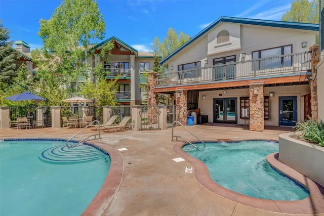 front view of a brick house with a yard