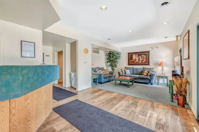 a view of a balcony with wooden floor