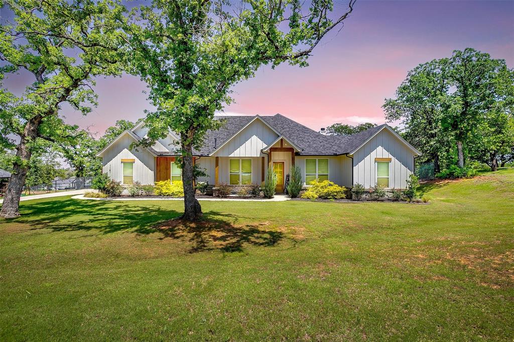 1141 Horizon Trace Drive Azle, TX 76020 - Photo 1 of 1 a front view of a house with garden