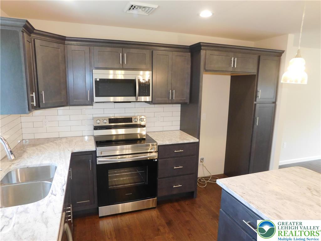 1365 Clearfield Road Nazareth, PA 18064 - Photo 12 of 30 a kitchen with a stove and a microwave