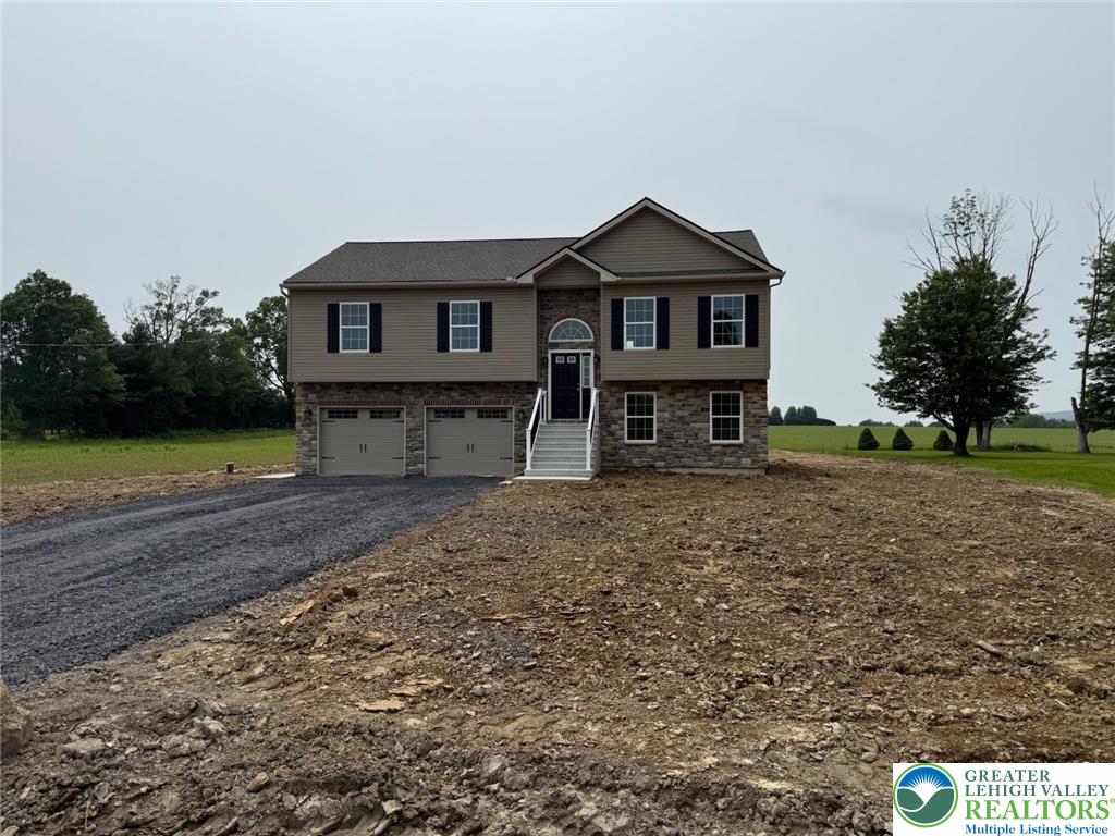 1365 Clearfield Road Nazareth, PA 18064 - Photo 3 of 30 a front view of a house with garden