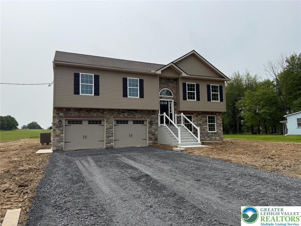 1365 Clearfield Road Nazareth, PA 18064 - Photo 5 of 30 a front view of a house with a yard