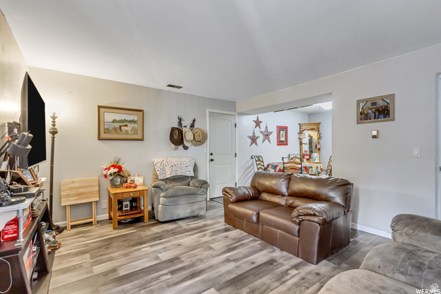 88 West 50 South, Unit B5 Centerville, UT 84014 - Photo 7 of 33 Living room with light wood-style flooring and baseboards