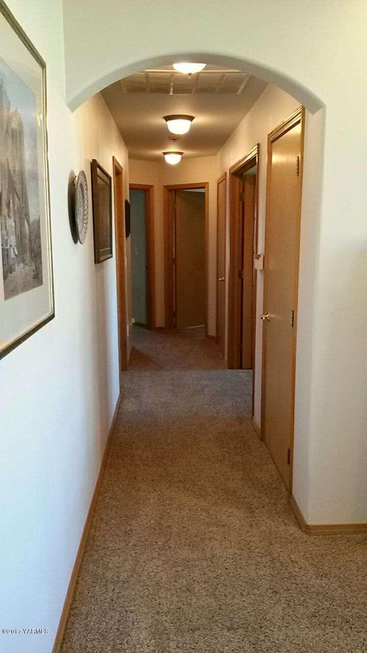 340 West Huntzinger Road Selah, WA 98942 - Photo 35 of 74 a view of a hallway with wooden shelves