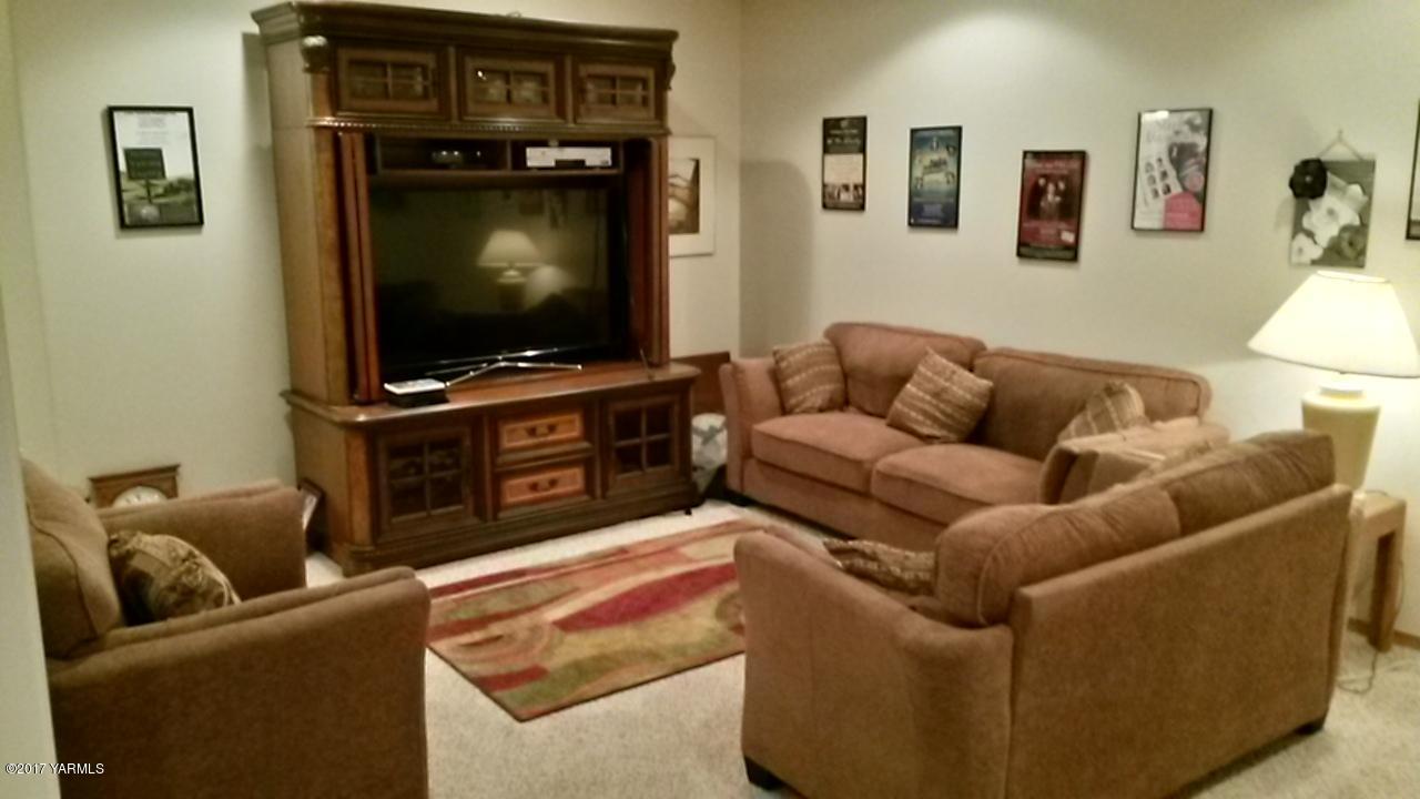 340 West Huntzinger Road Selah, WA 98942 - Photo 54 of 74 a living room with furniture and a flat screen tv