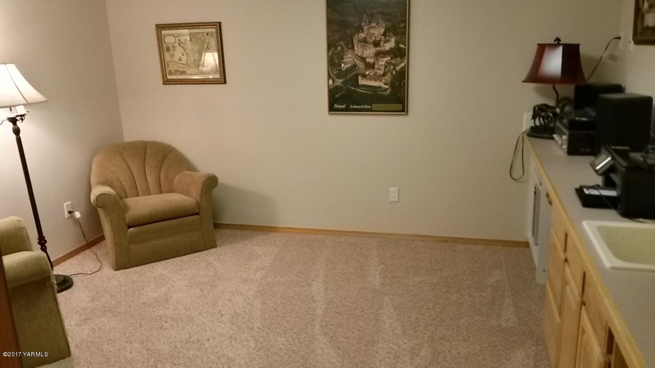 340 West Huntzinger Road Selah, WA 98942 - Photo 57 of 74 a living room with furniture and a flat screen tv