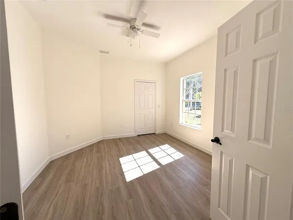 a view of a small space with wooden floor