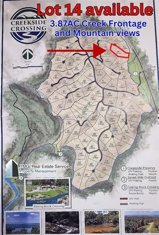 a view of a park with iron fence