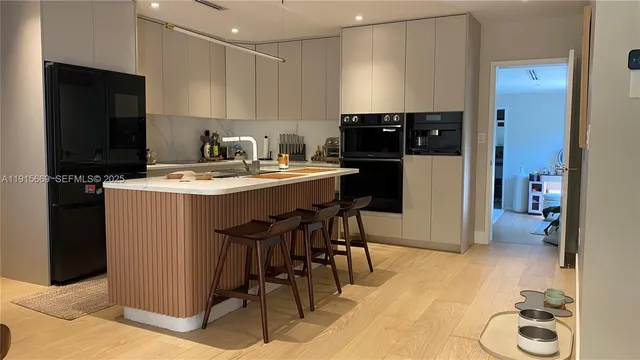 a kitchen with a sink a stove and refrigerator
