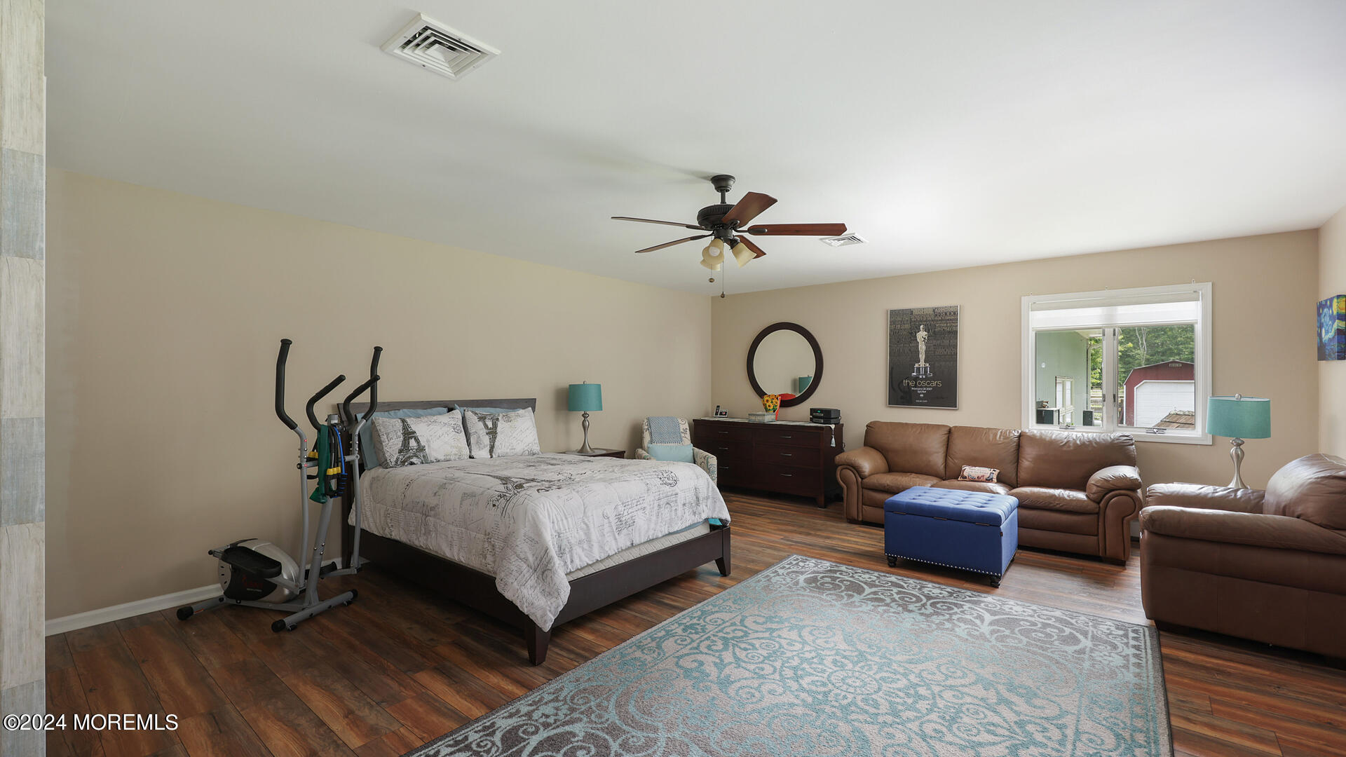 191 Victory Road Howell, NJ 07731 - Photo 20 of 54 a bedroom with a bed and a chandelier