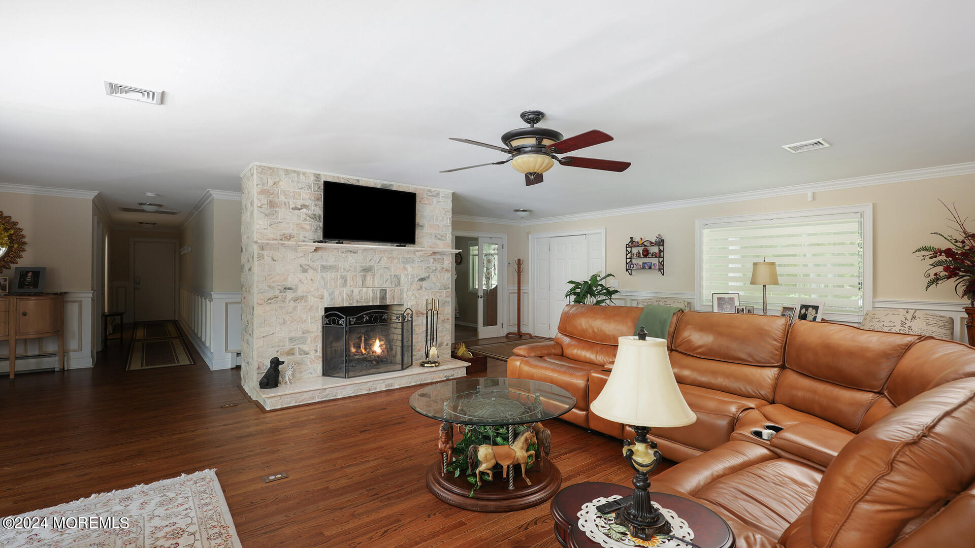 191 Victory Road Howell, NJ 07731 - Photo 3 of 54 a living room with furniture a fireplace and a flat screen tv