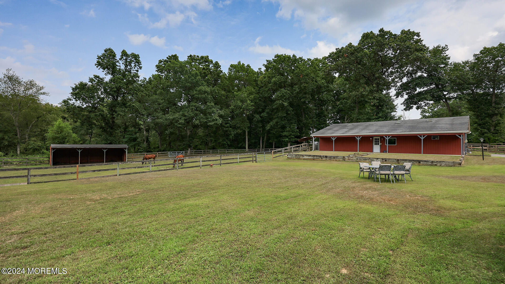 191 Victory Road Howell, NJ 07731 - Photo 38 of 54 a backyard of a house with table and chairs