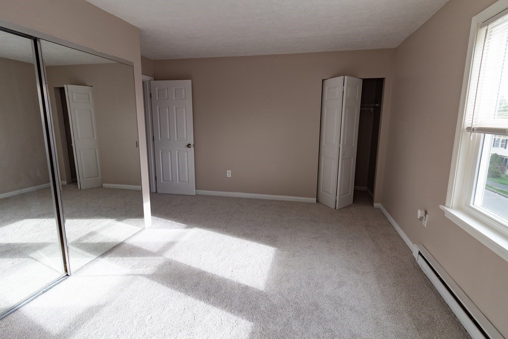 20 Rice Lane, Unit 2 Worcester, MA 01604 - Photo 12 of 17 a view of an empty room with a fireplace