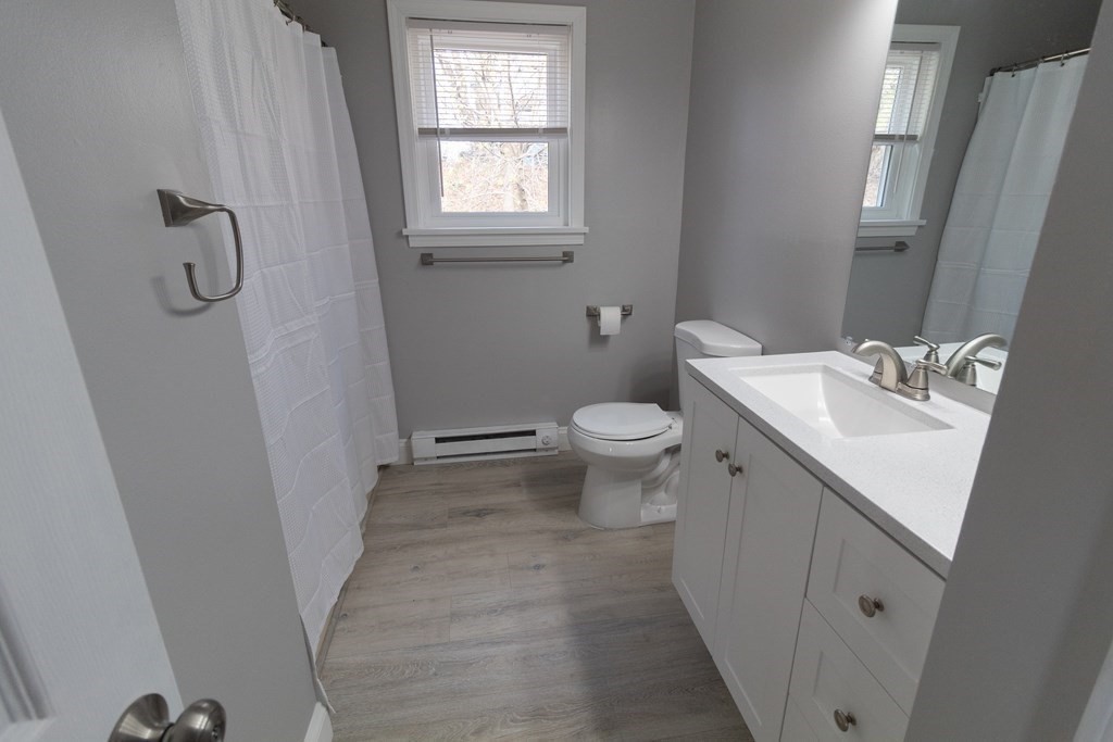 20 Rice Lane, Unit 2 Worcester, MA 01604 - Photo 7 of 17 a bathroom with a sink a toilet and shower
