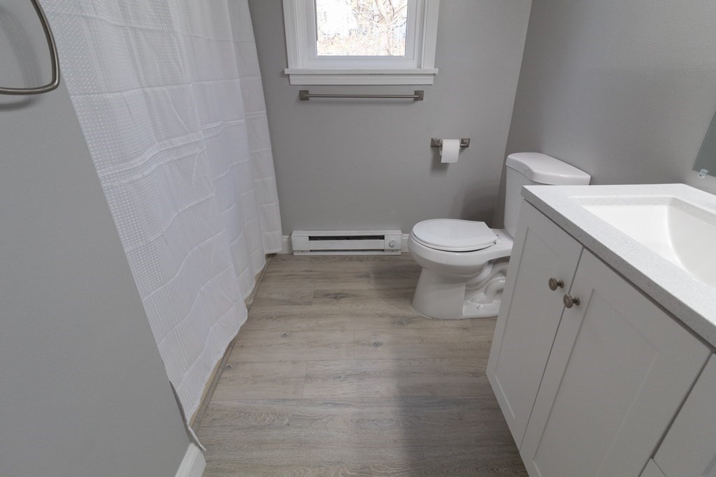 20 Rice Lane, Unit 2 Worcester, MA 01604 - Photo 8 of 17 a bathroom with a toilet and a sink