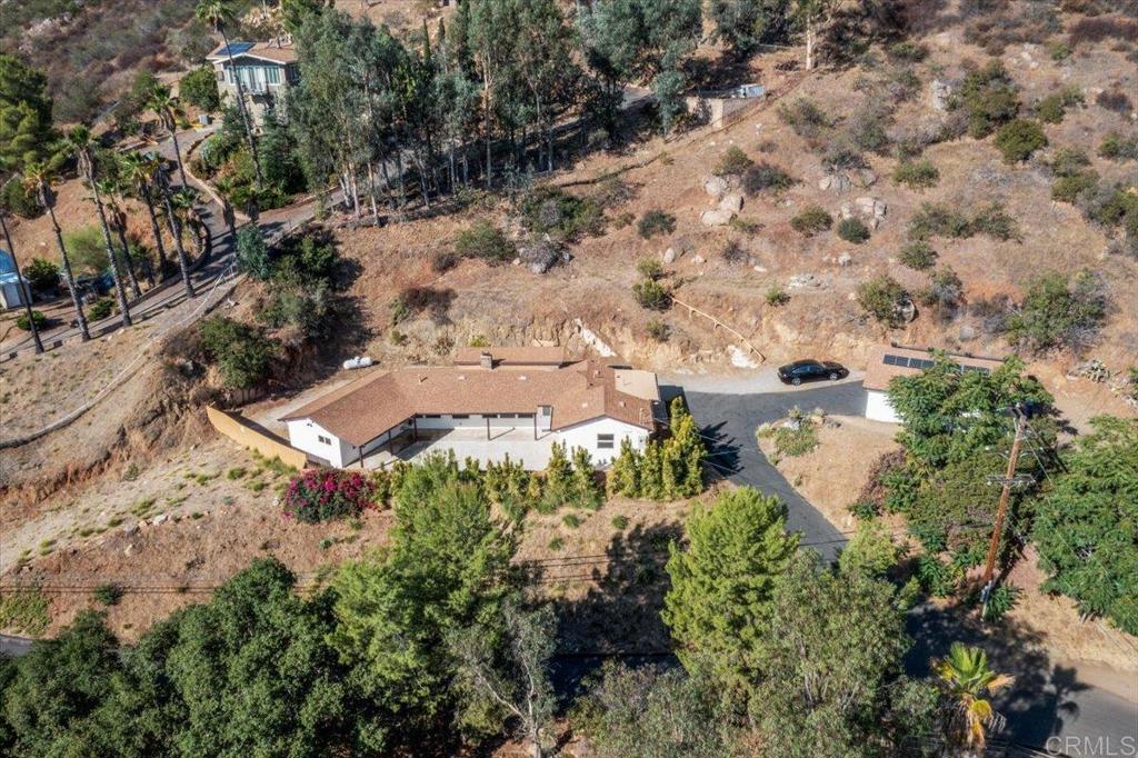 an aerial view of residential house with outdoor space